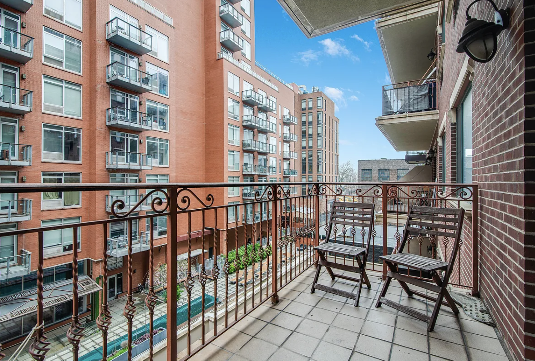 41-26 27th Street, Unit 4B Queens, NY 11101 - Photo 5 of 10 a view of a chairs and table in the balcony