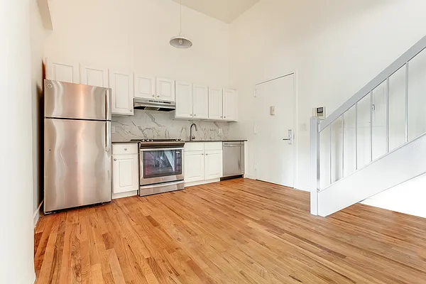 204 Huntington Street, Unit 1D Brooklyn, NY 11231 - Photo 2 of 12 a open kitchen with cabinets and stainless steel appliances