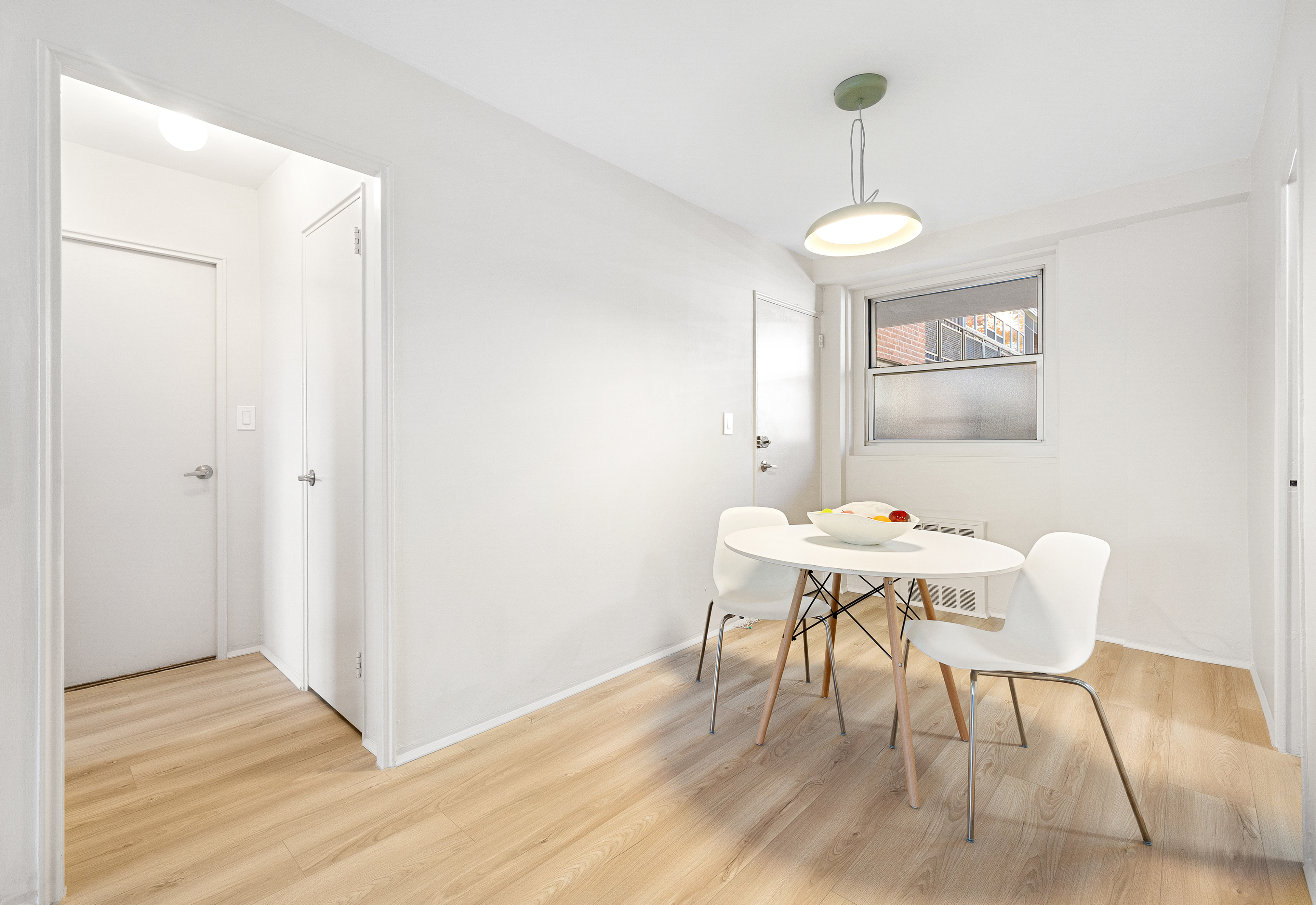 35-51 85th Street, Unit 4M Queens, NY 11372 - Photo 5 of 10 a view of a dining room with furniture and wooden floor