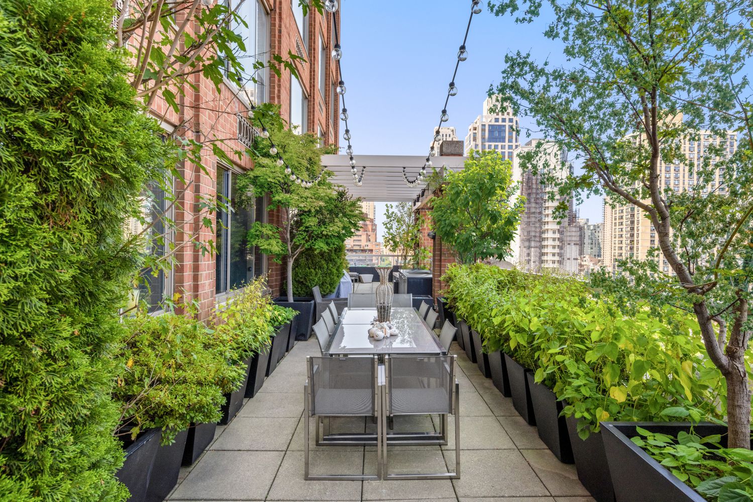 a view of a pathway with flower plants