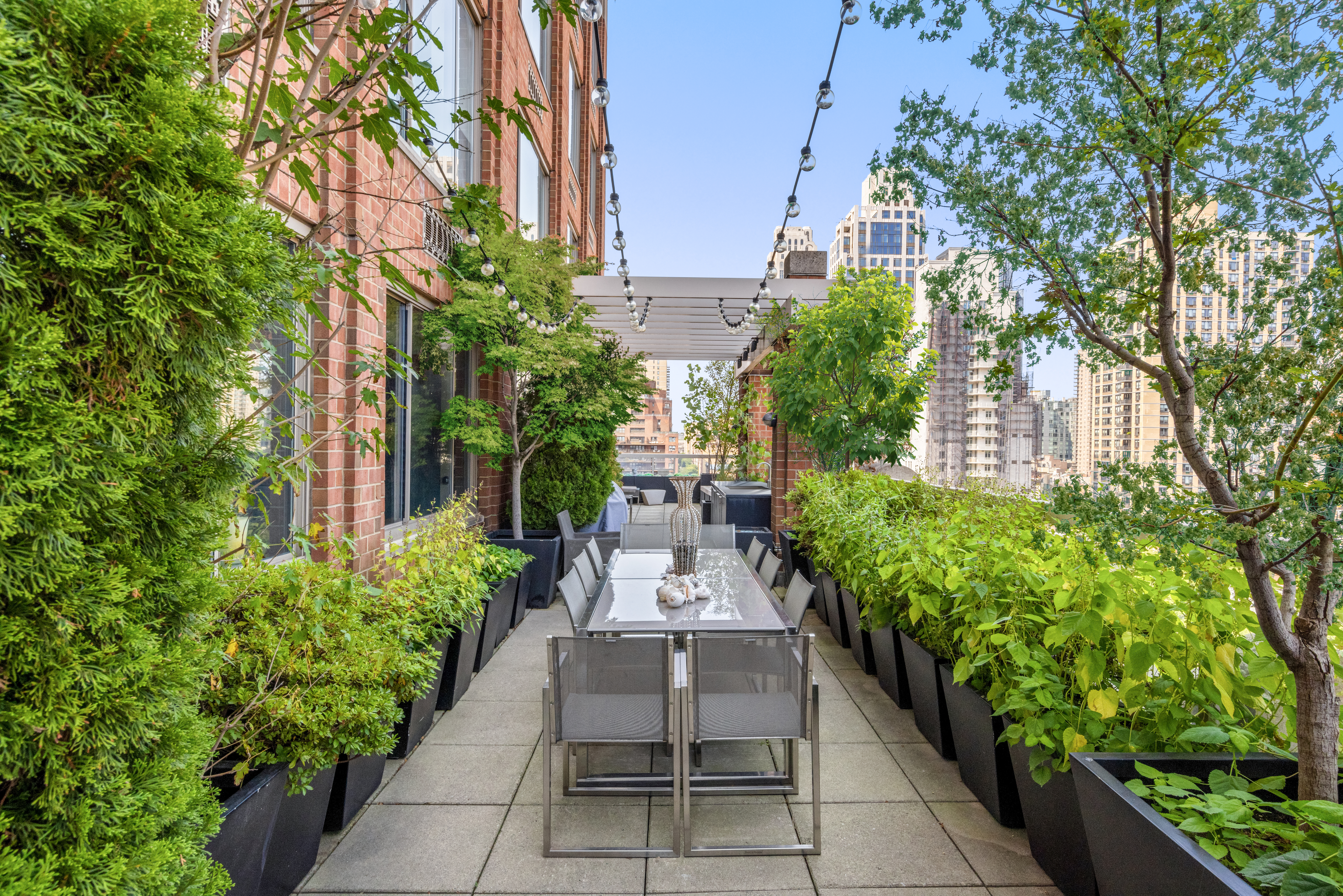 350 East 82nd Street, Unit 14AB Manhattan, NY 10028 - Photo 2 of 21 a view of a pathway with flower plants