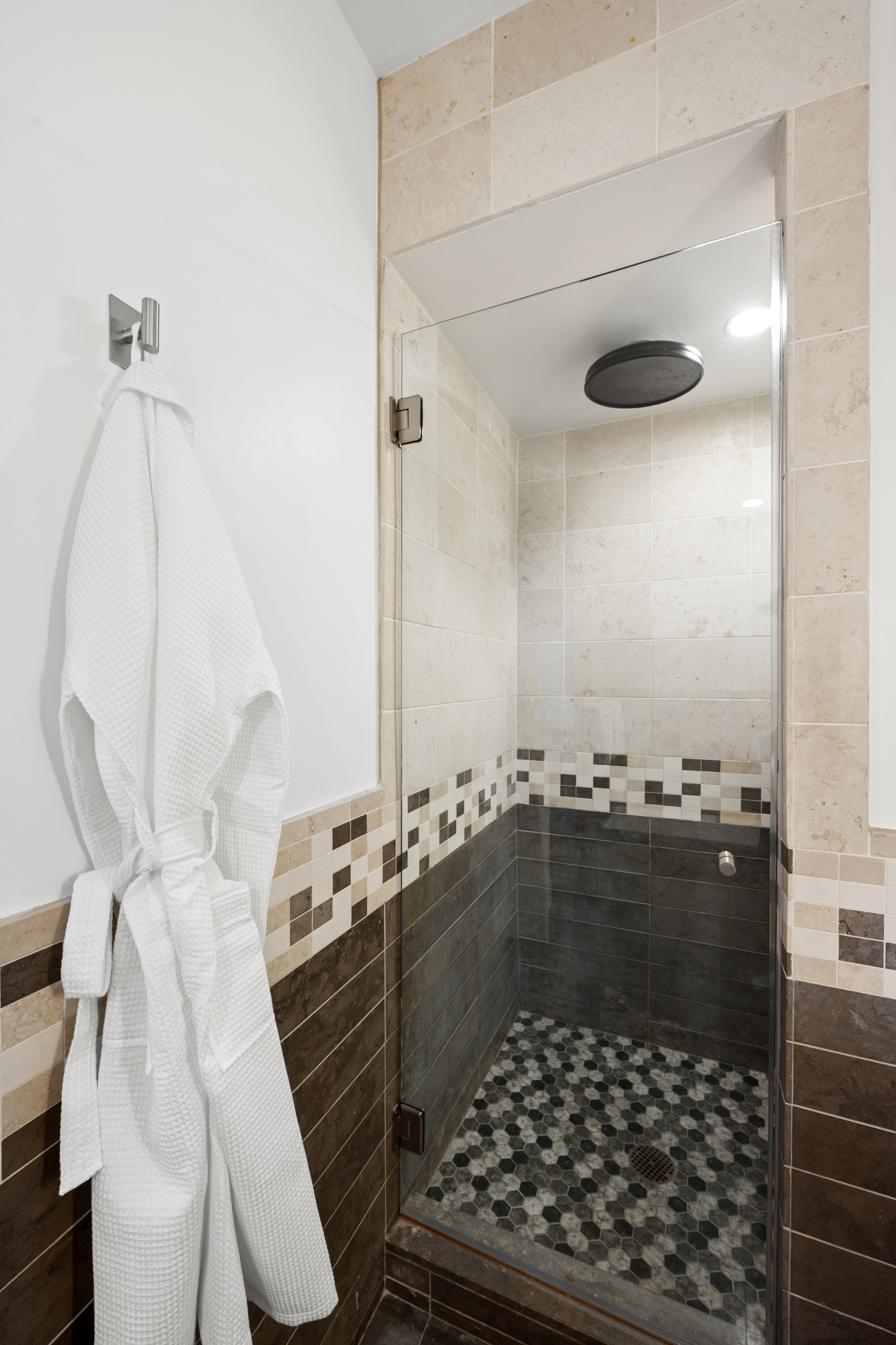 101 West 24th Street, Unit 23E Manhattan, NY 10011 - Photo 11 of 23 a bathroom with a glass door shower and a sink