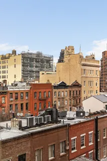 a view of a large building with a city skyline
