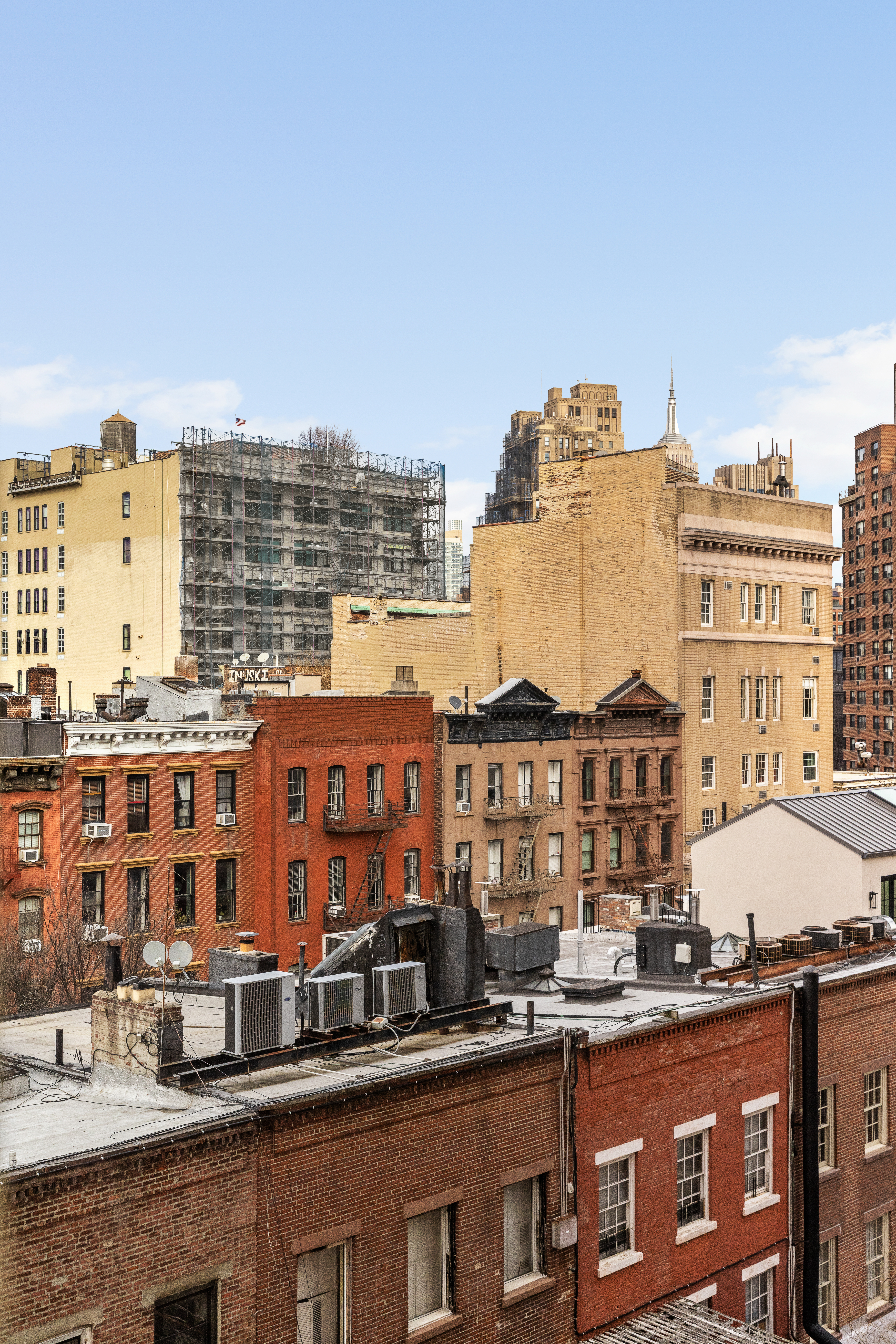299 West 12th Street, Unit 7BC Manhattan, NY 10014 - Photo 12 of 16 a view of a large building with a city skyline