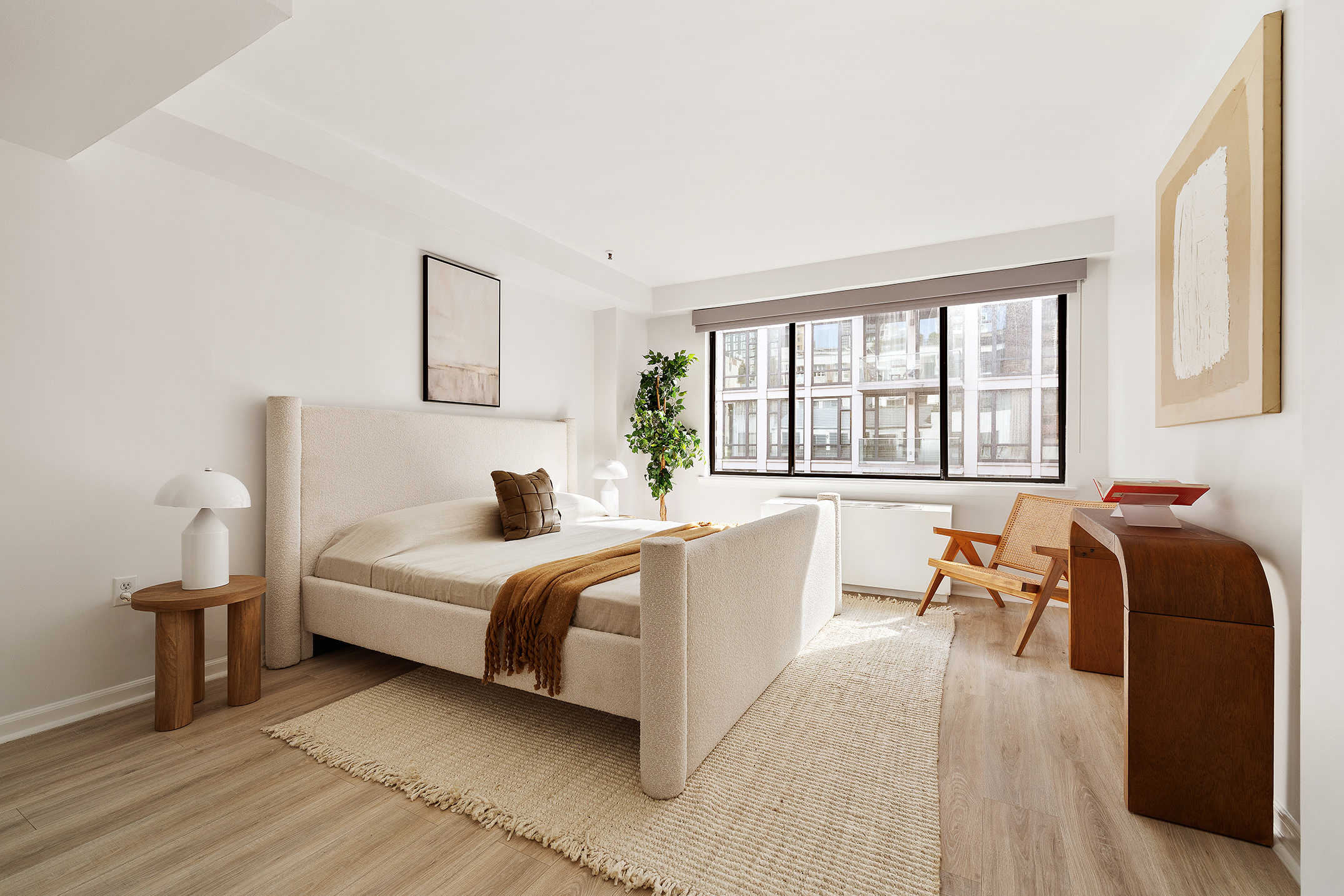 136-140 West 23rd Street, Unit PHD Manhattan, NY 10011 - Photo 10 of 15 a bed room with a bed and a chair