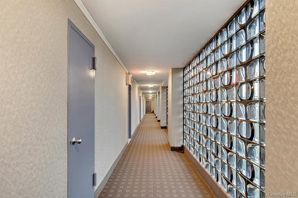 2400 Johnson Avenue, Unit 3B Bronx, NY 10463 - Photo 19 of 28 a view of a hallway with wooden floor and staircase