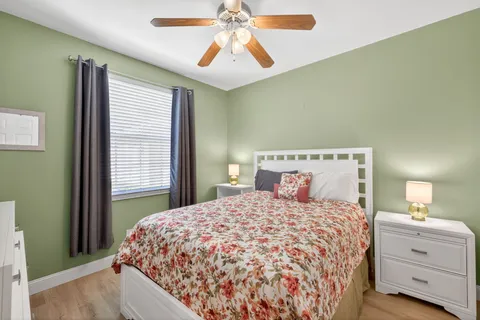 a bedroom with a large bed and a window