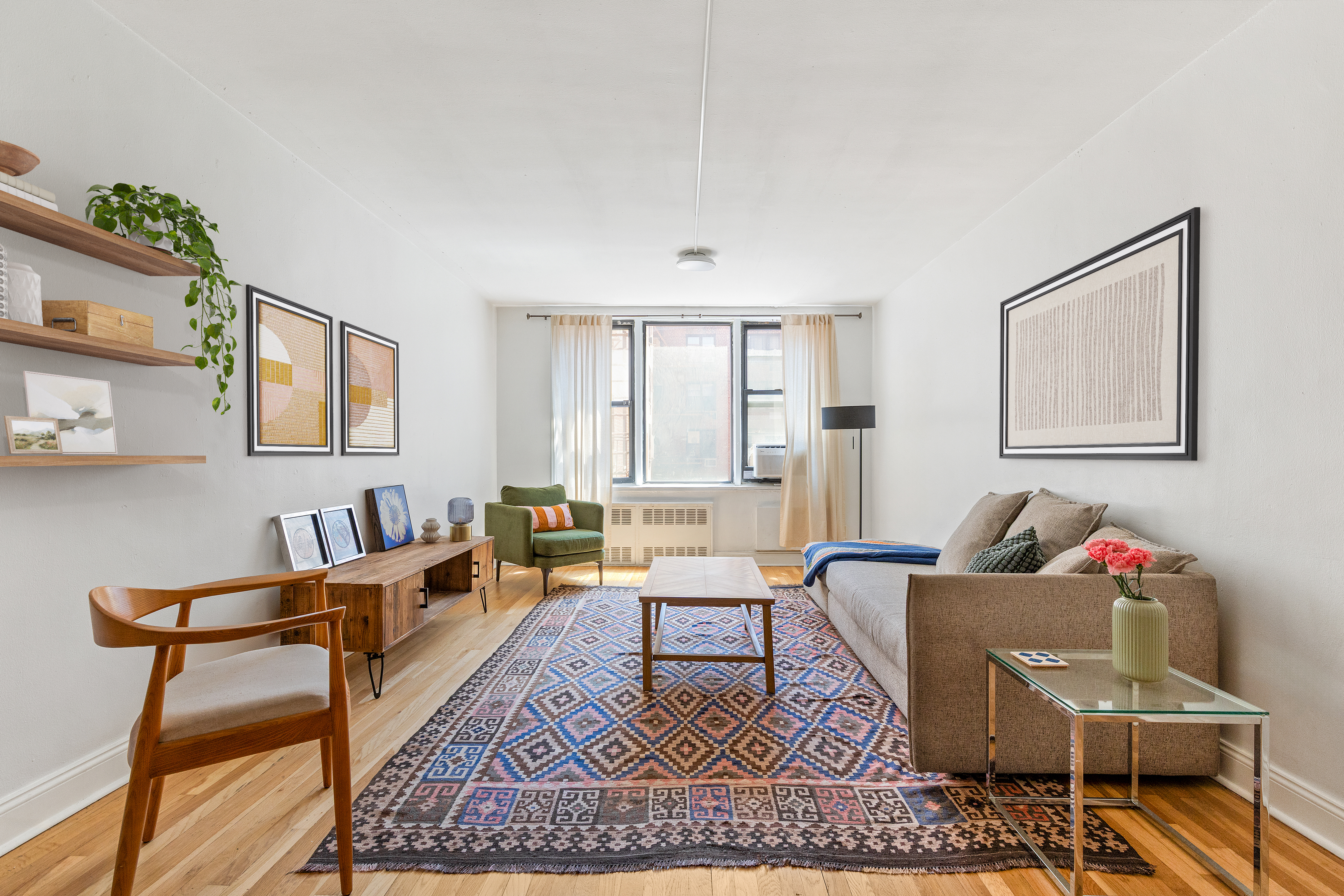 a living room with furniture and a window