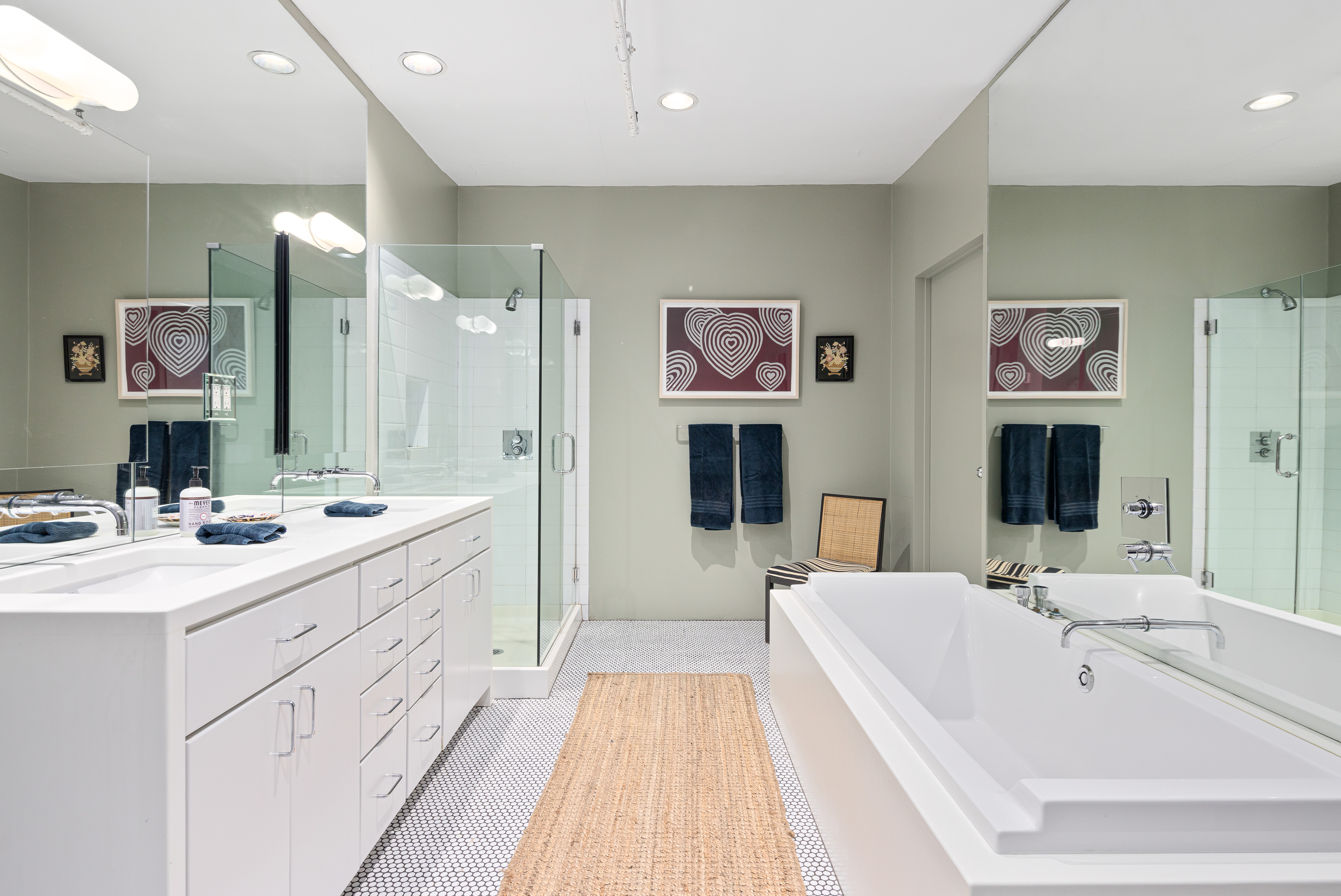 191 Chrystie Street, Unit 5R Manhattan, NY 10002 - Photo 8 of 16 a spacious bathroom with a double vanity sink mirror and double