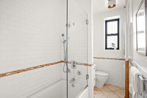 a bathroom with a toilet a sink and a bathtub
