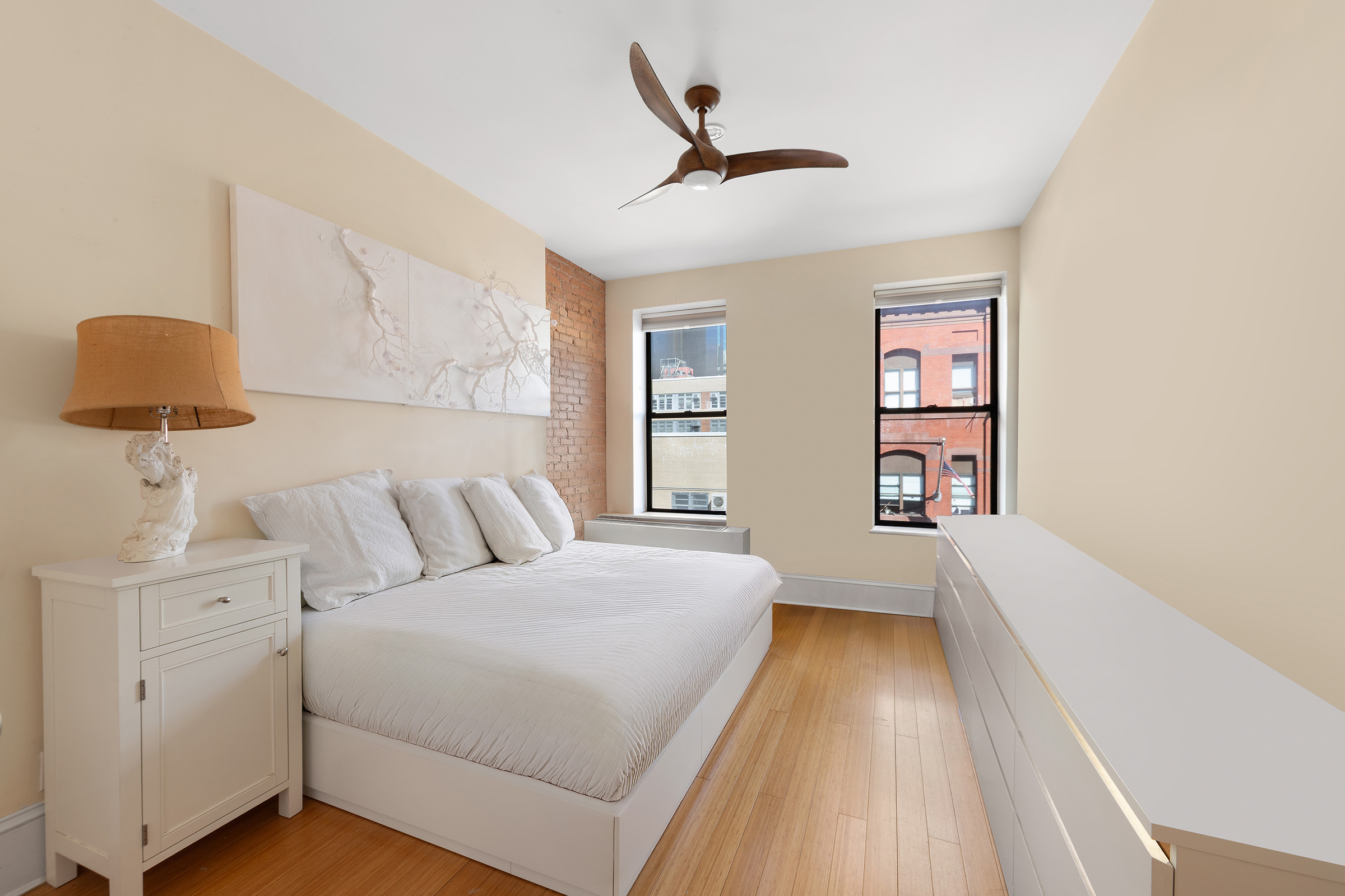 216 East 75th Street, Unit 3EAST Manhattan, NY 10021 - Photo 5 of 9 a bedroom with a bed and a window