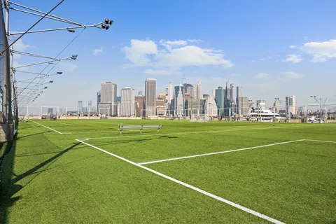 a view of a lake with tall building