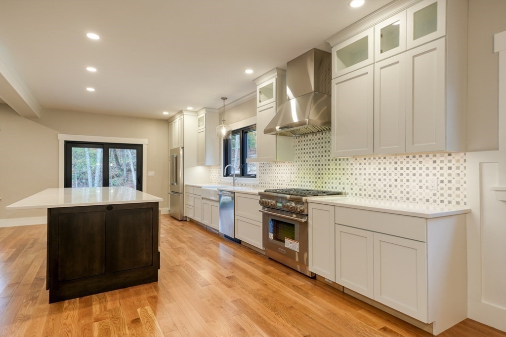 171 Randall Road Berlin, MA 01503 - Photo 9 of 41 a kitchen with stainless steel appliances granite countertop a stove and a sink