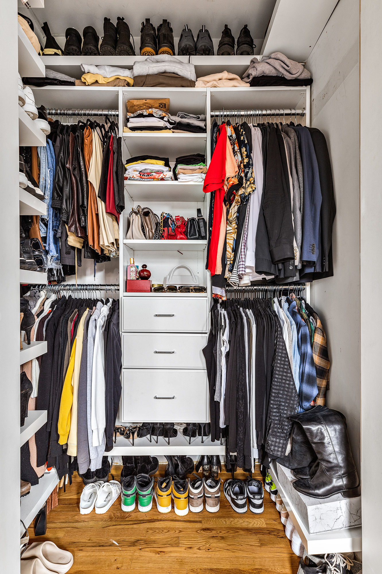 167 Grand Street, Unit 2 Brooklyn, NY 11249 - Photo 5 of 7 a view of walk in closet with clothes and shoes