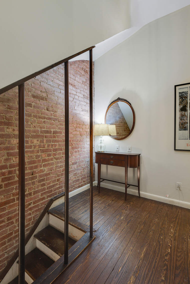 217 West 15th Street Manhattan, NY 10011 - Photo 12 of 21 a view of a livingroom with furniture