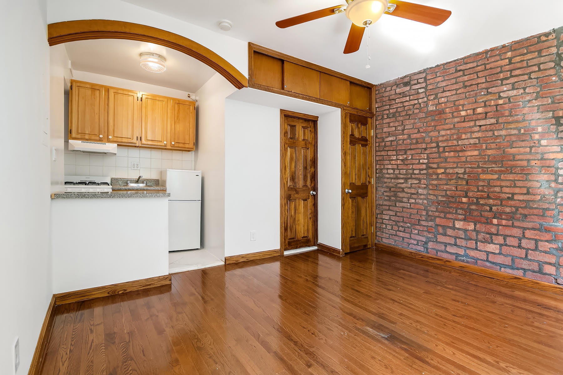 49 Perry Street, Unit 1E Manhattan, NY 10014 - Photo 2 of 3 a view of a livingroom with wooden floor
