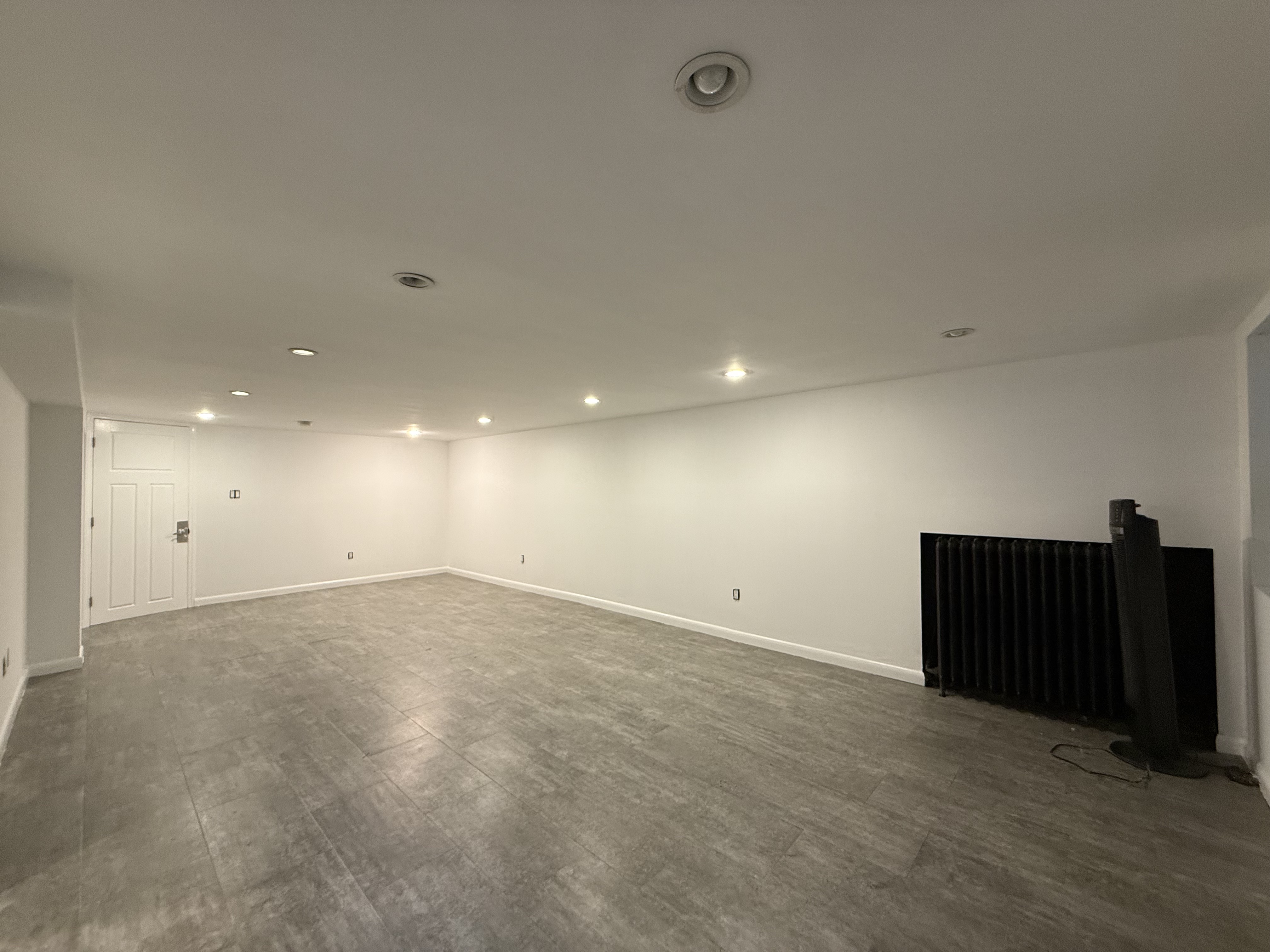 249 94th Street, Unit 1 Brooklyn, NY 11209 - Photo 9 of 13 an empty room with furniture and wooden floor