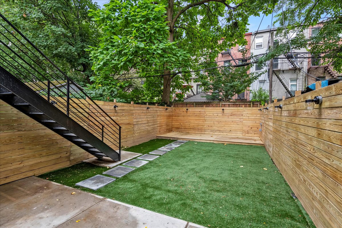 448 Halsey Street, Unit 1 Brooklyn, NY 11233 - Photo 20 of 22 a view of a back yard of the house