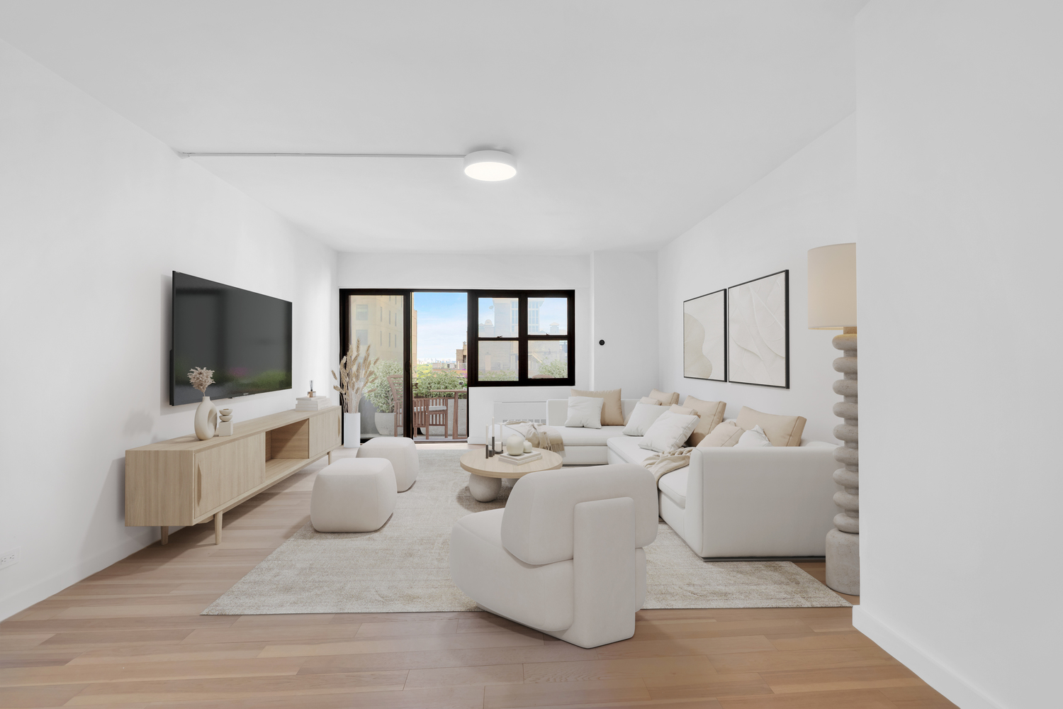 58 West 58th Street, Unit 21C Manhattan, NY 10019 - Photo 2 of 12 a large living room with furniture and a flat screen tv