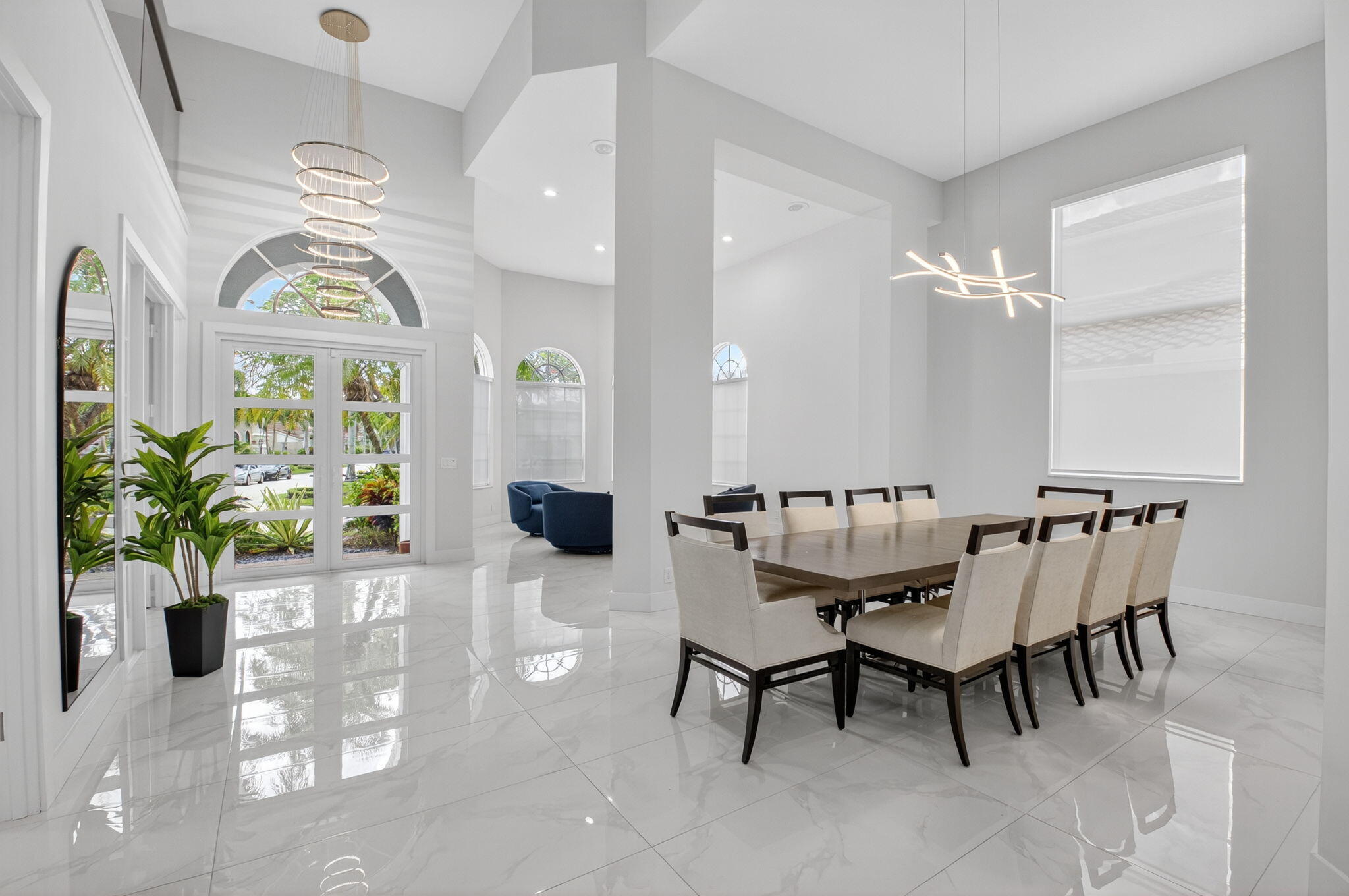 6529 Somerset Circle Boca Raton, FL 33496 - Photo 10 of 75 a view of a dining room with furniture a chandelier and a window