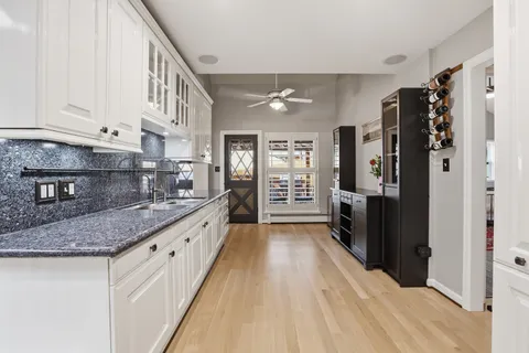 a view of outdoor space with wooden floor and outdoor seating