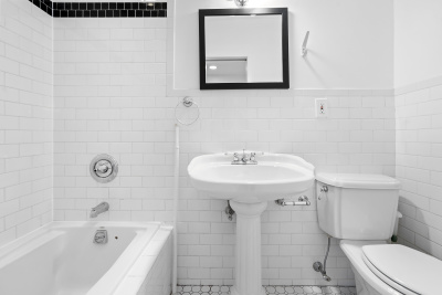 67 Gates Avenue, Unit 2 Brooklyn, NY 11238 - Photo 4 of 4 a bathroom with a sink a toilet and shower