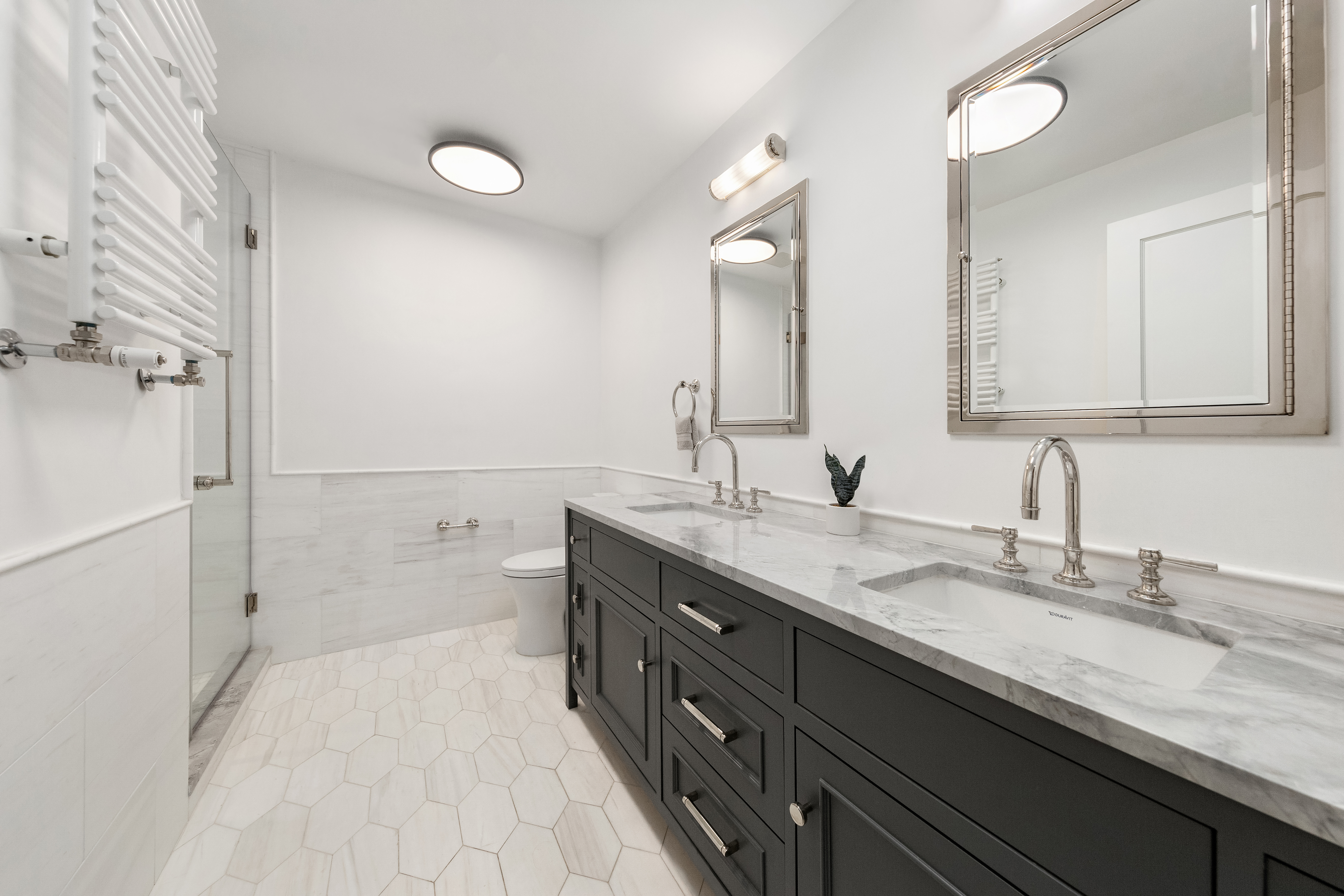 110 West 81st Street Manhattan, NY 10024 - Photo 11 of 30 a spacious bathroom with a granite countertop double vanity sink a mirror and a bathtub