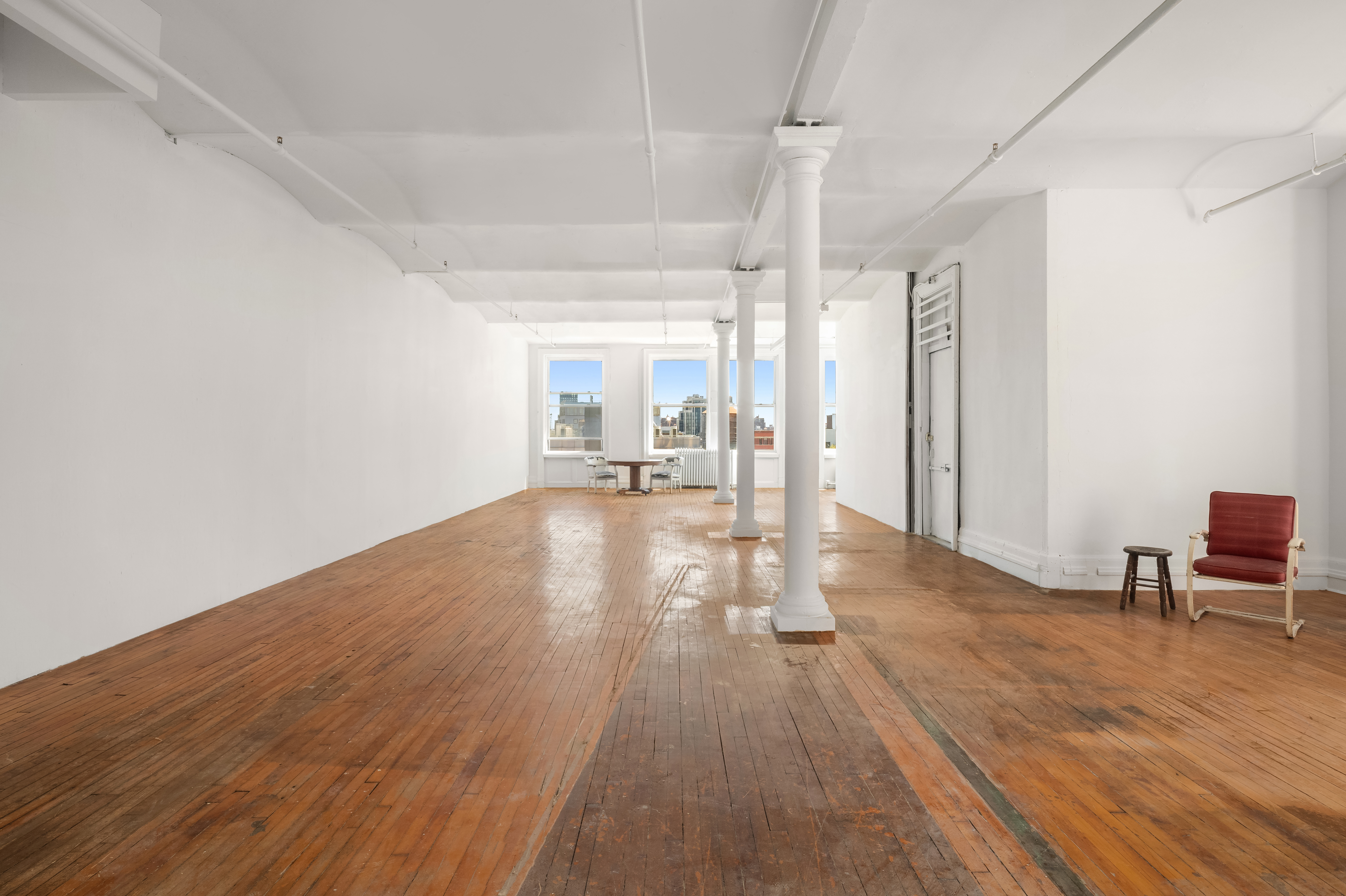 491 Broadway Manhattan, NY 10012 - Photo 4 of 11 a view of a room with wooden floor