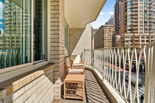 a view of balcony with wooden floor