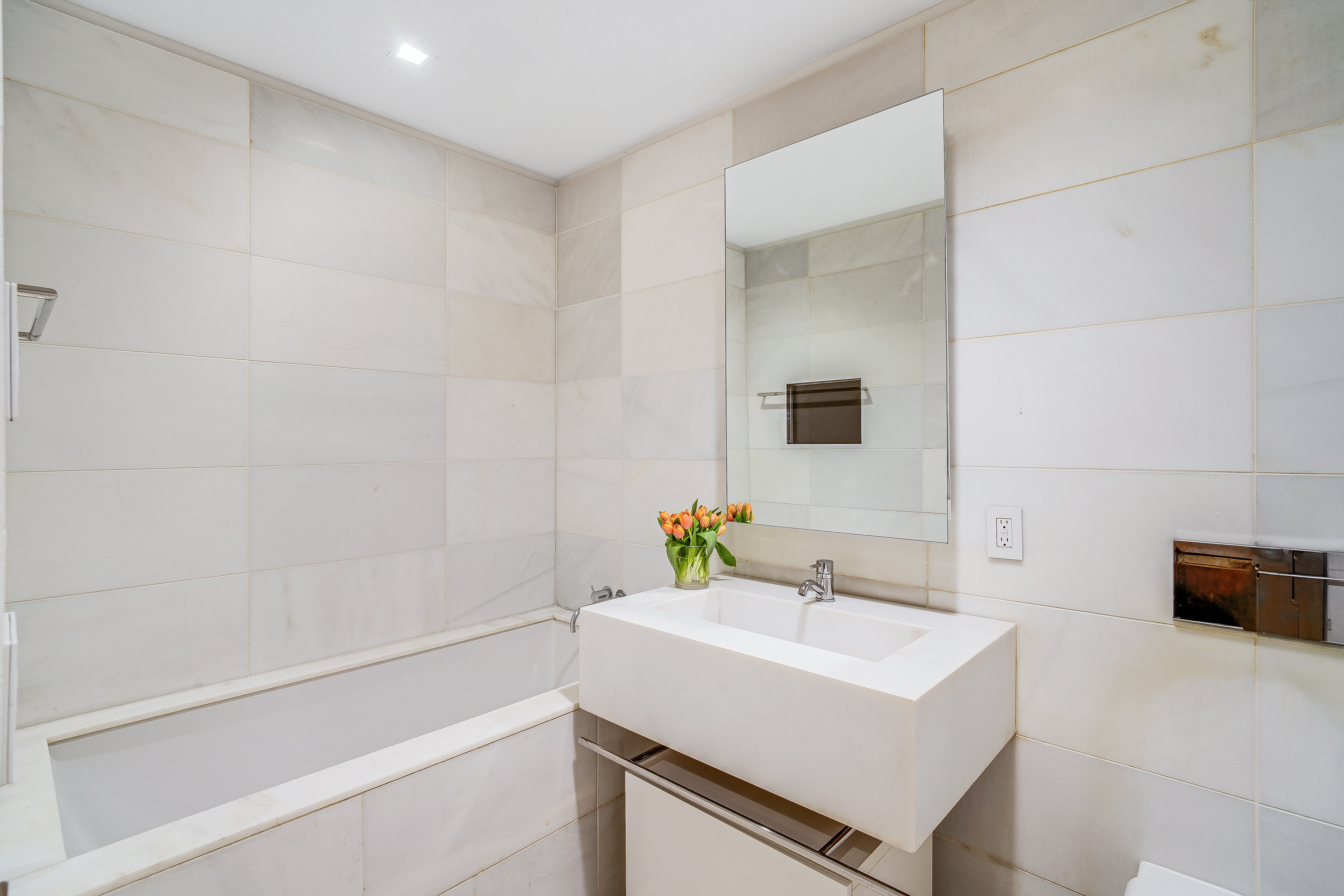400 East 67th Street, Unit 3CD Manhattan, NY 10065 - Photo 6 of 28 a bathroom with a sink a toilet and a bathtub