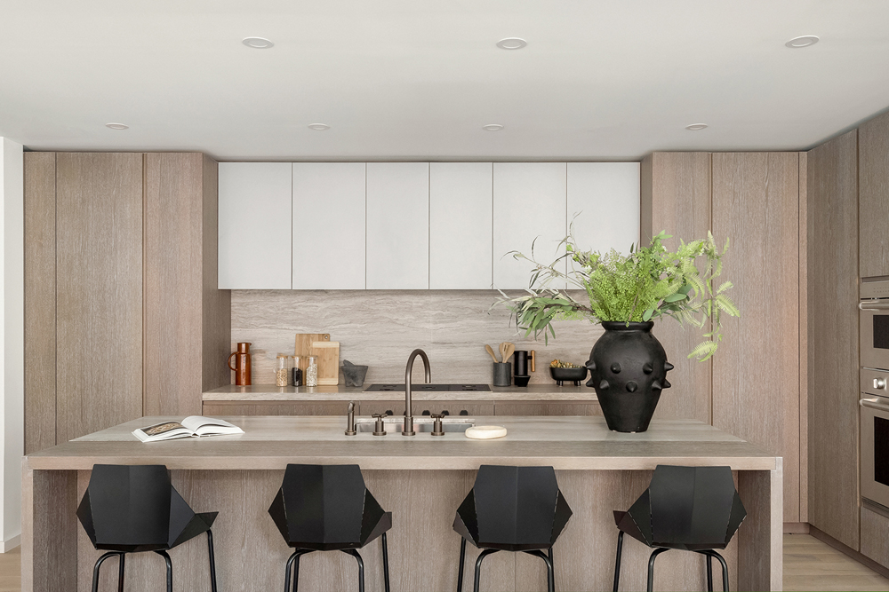 66 Clinton Street, Unit 6A Manhattan, NY 10002 - Photo 6 of 17 a kitchen with a sink cabinets and chair