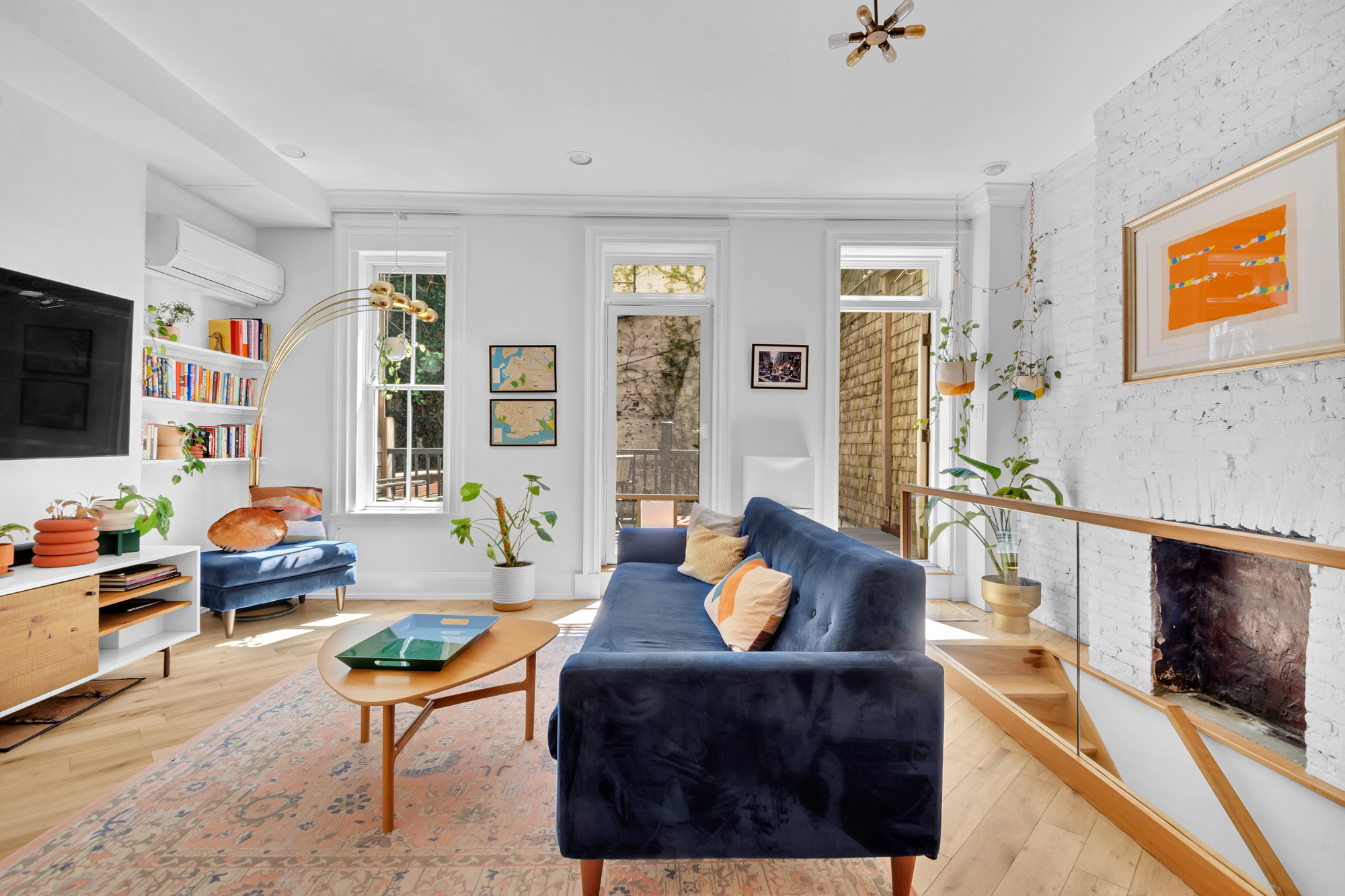 361 6th Avenue, Unit 1 Brooklyn, NY 11215 - Photo 2 of 11 a living room with furniture fireplace and a flat screen tv