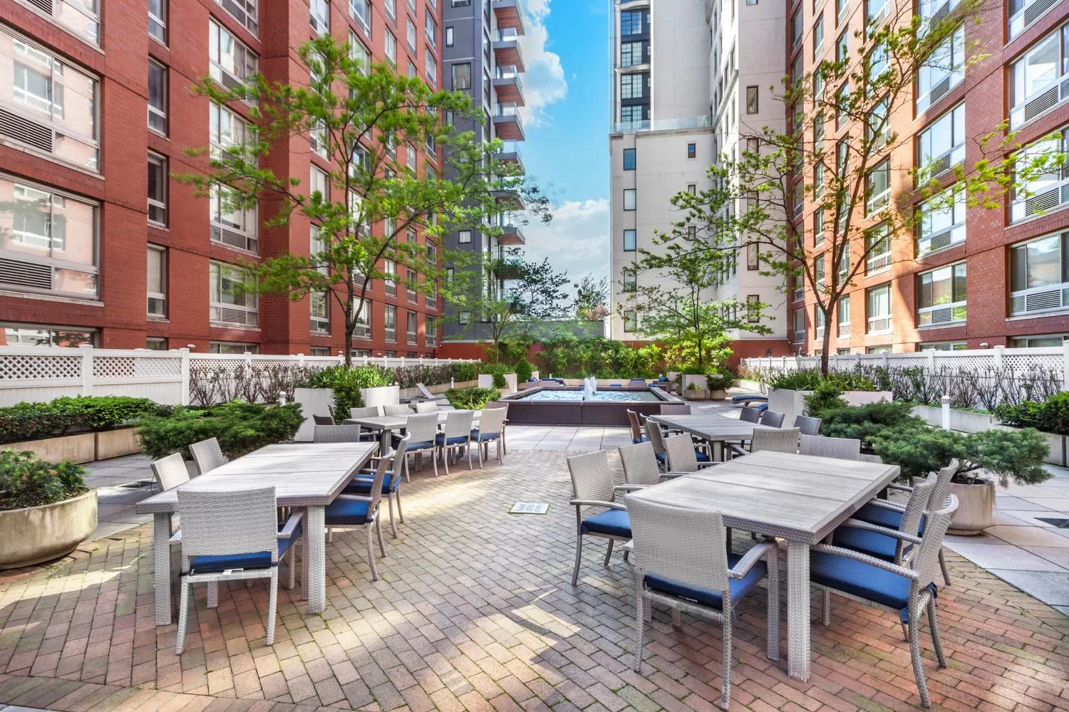 555 West 23rd Street, Unit S11C Manhattan, NY 10011 - Photo 9 of 12 a view of a patio with a table and chairs and potted plants