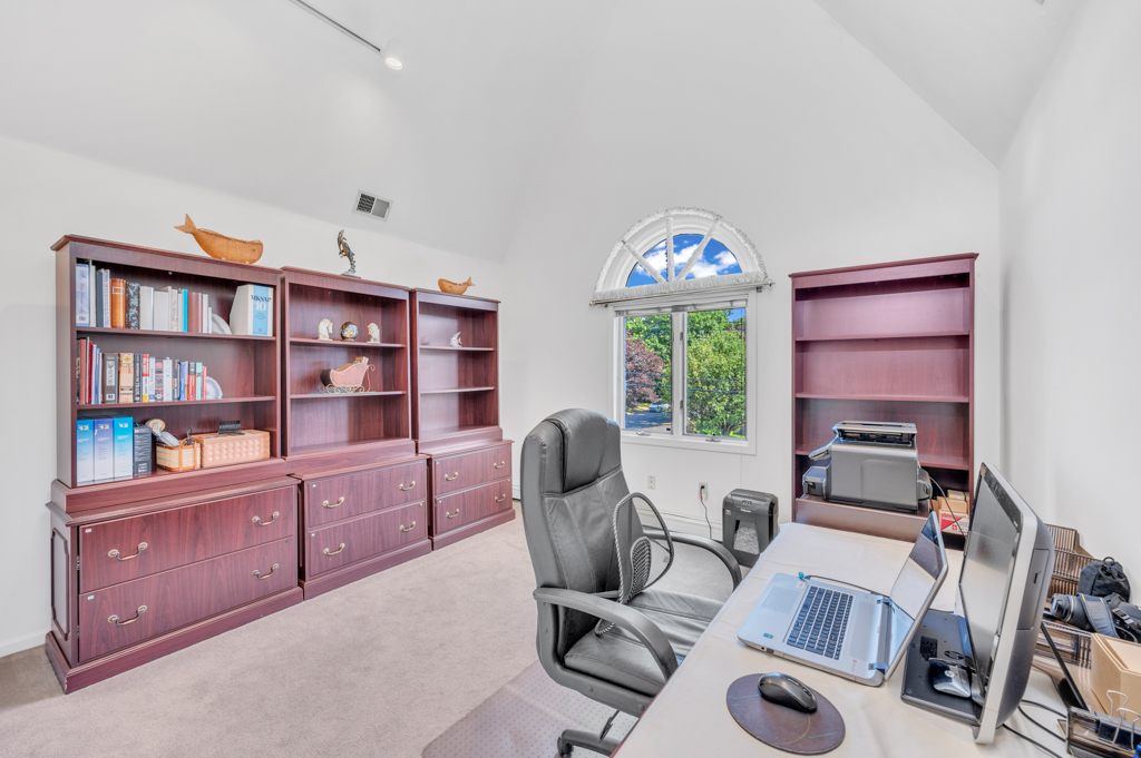35 Poe Street Staten Island, NY 10307 - Photo 17 of 36 a view of a workspace with furniture and a book shelf