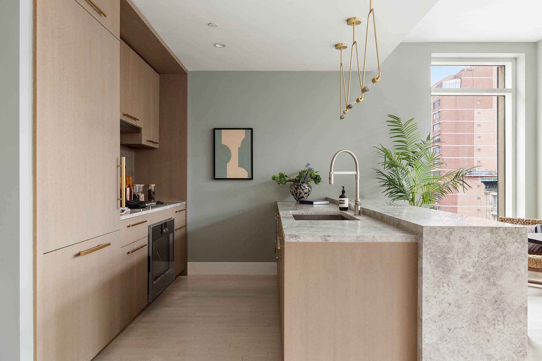 91 Leonard Street, Unit 14A Manhattan, NY 10013 - Photo 6 of 27 a kitchen with stainless steel appliances granite countertop a sink a stove and a refrigerator
