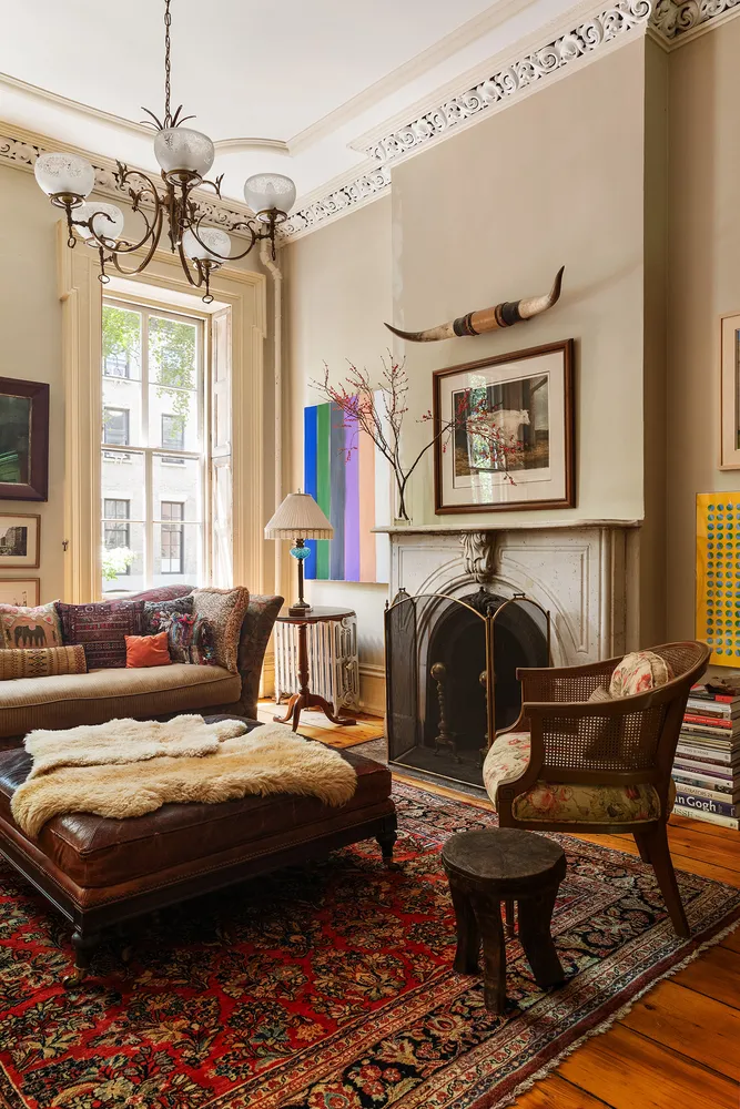 a bedroom with furniture and a fireplace