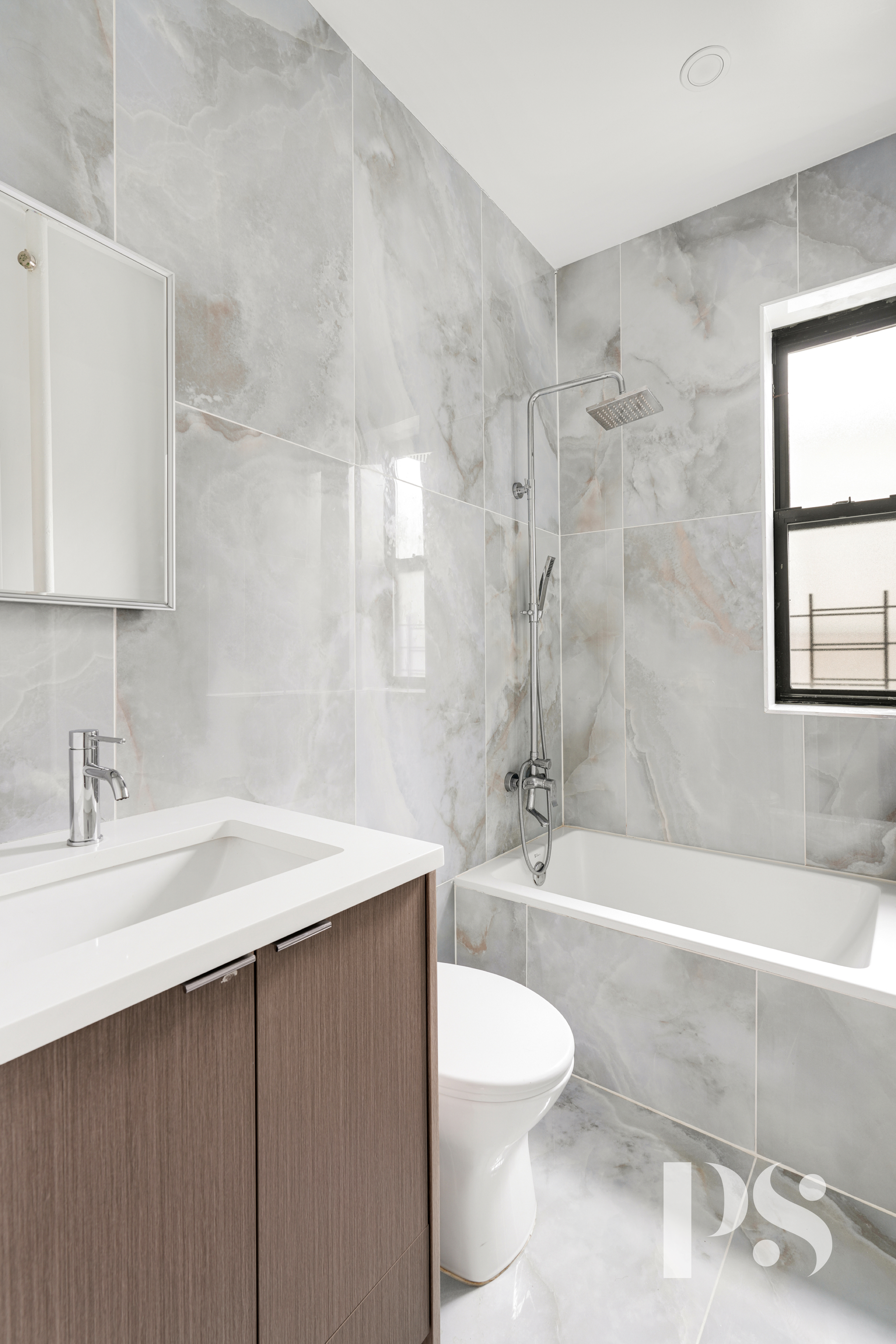 24-51 38th Street, Unit D1 Queens, NY 11103 - Photo 5 of 7 a bathroom with a sink a toilet and shower