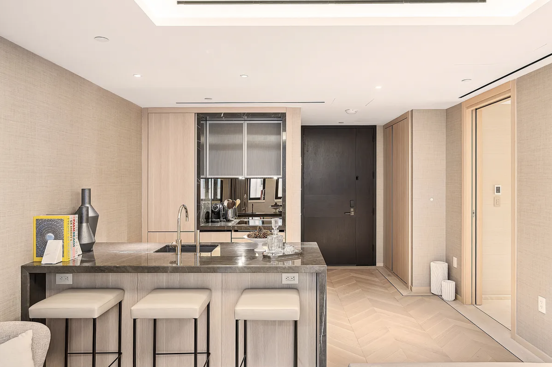 685 5th Avenue, Unit 6B Manhattan, NY 10022 - Photo 4 of 18 a kitchen with stainless steel appliances granite countertop a sink and cabinets