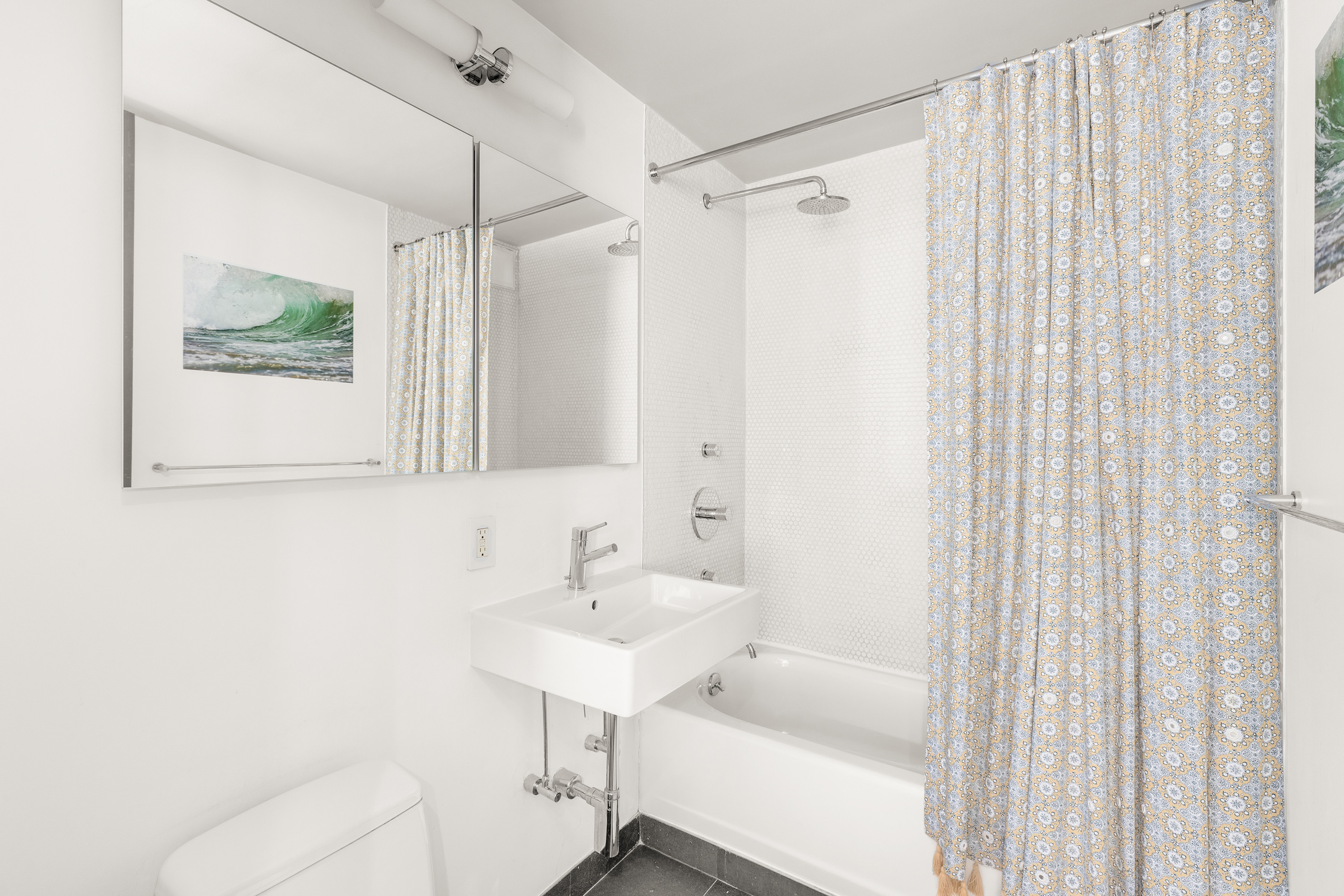 201 East 17th Street, Unit 31E Manhattan, NY 10003 - Photo 5 of 15 a bathroom with a sink toilet and shower