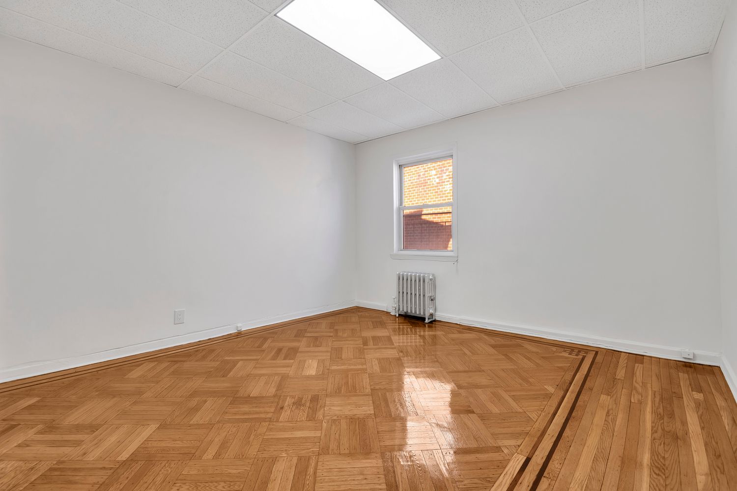 7001 Shore Road, Unit 2 Brooklyn, NY 11209 - Photo 6 of 17 a view of an empty room and window