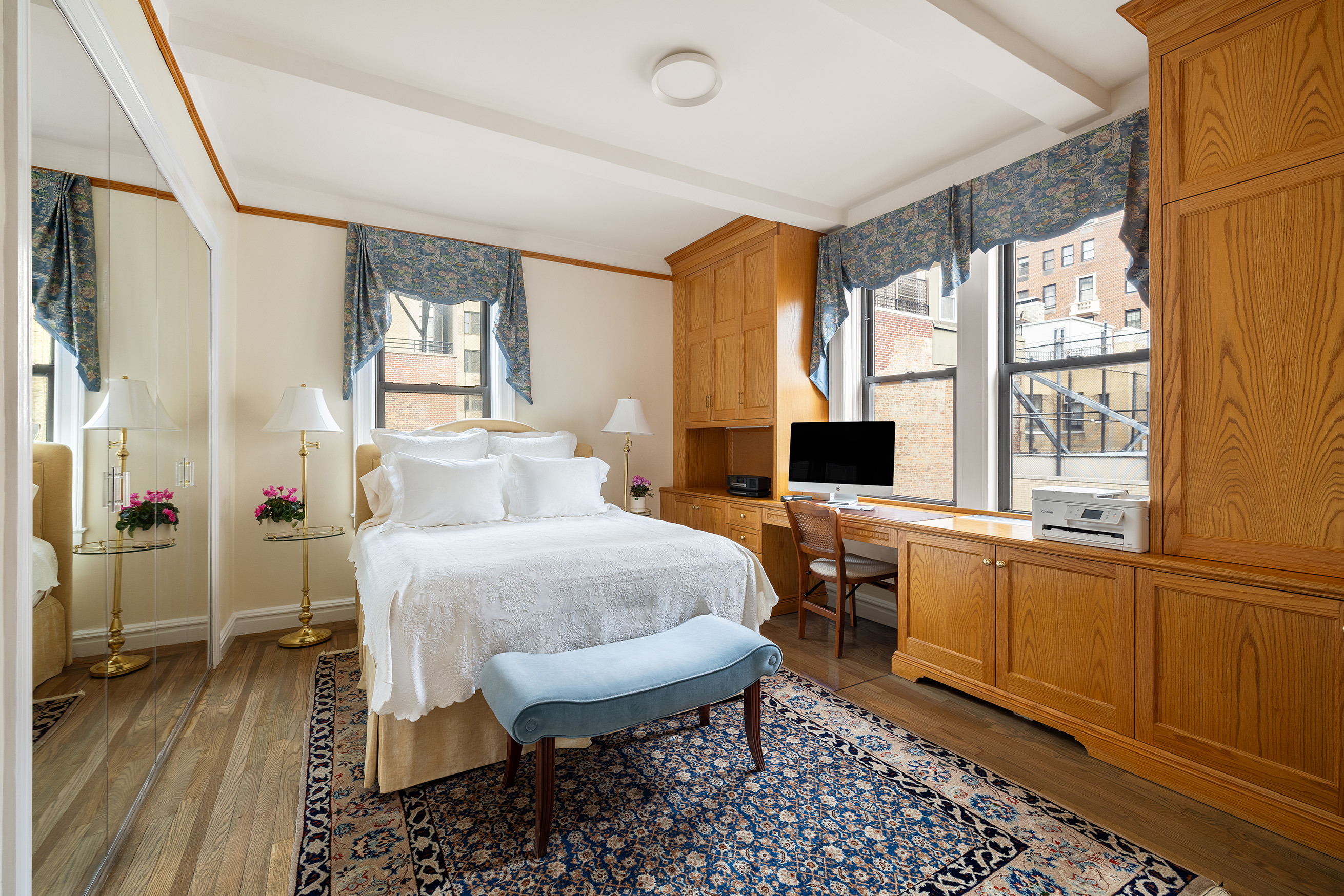 119 East 84th Street, Unit 9C Manhattan, NY 10028 - Photo 5 of 10 a spacious bedroom with a bed and a table