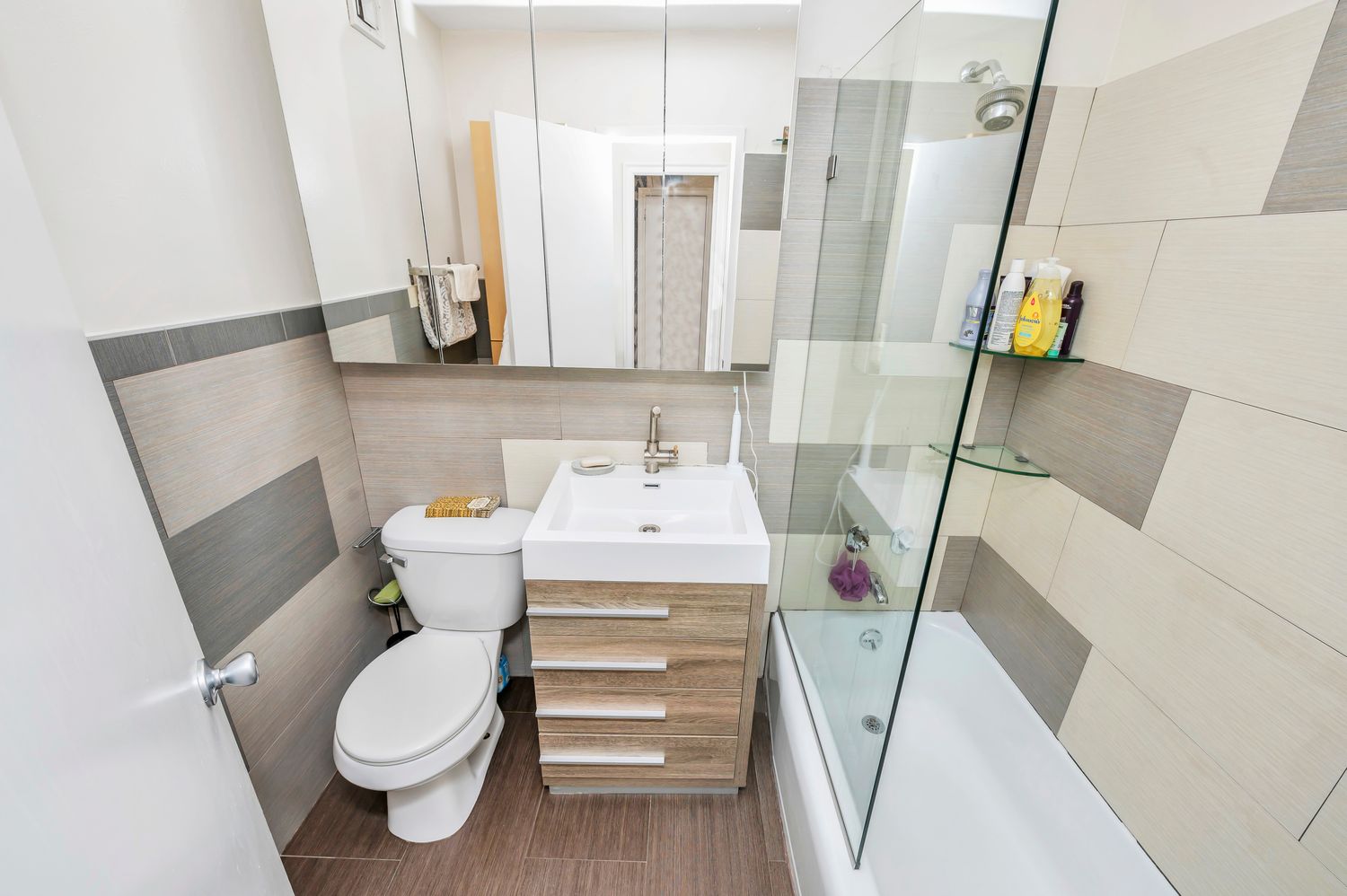 333 East 79th Street, Unit 2R Manhattan, NY 10075 - Photo 12 of 13 a white toilet sitting next to a bathroom sink