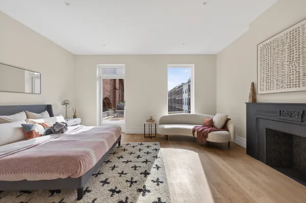 a bedroom with a bed and a couch