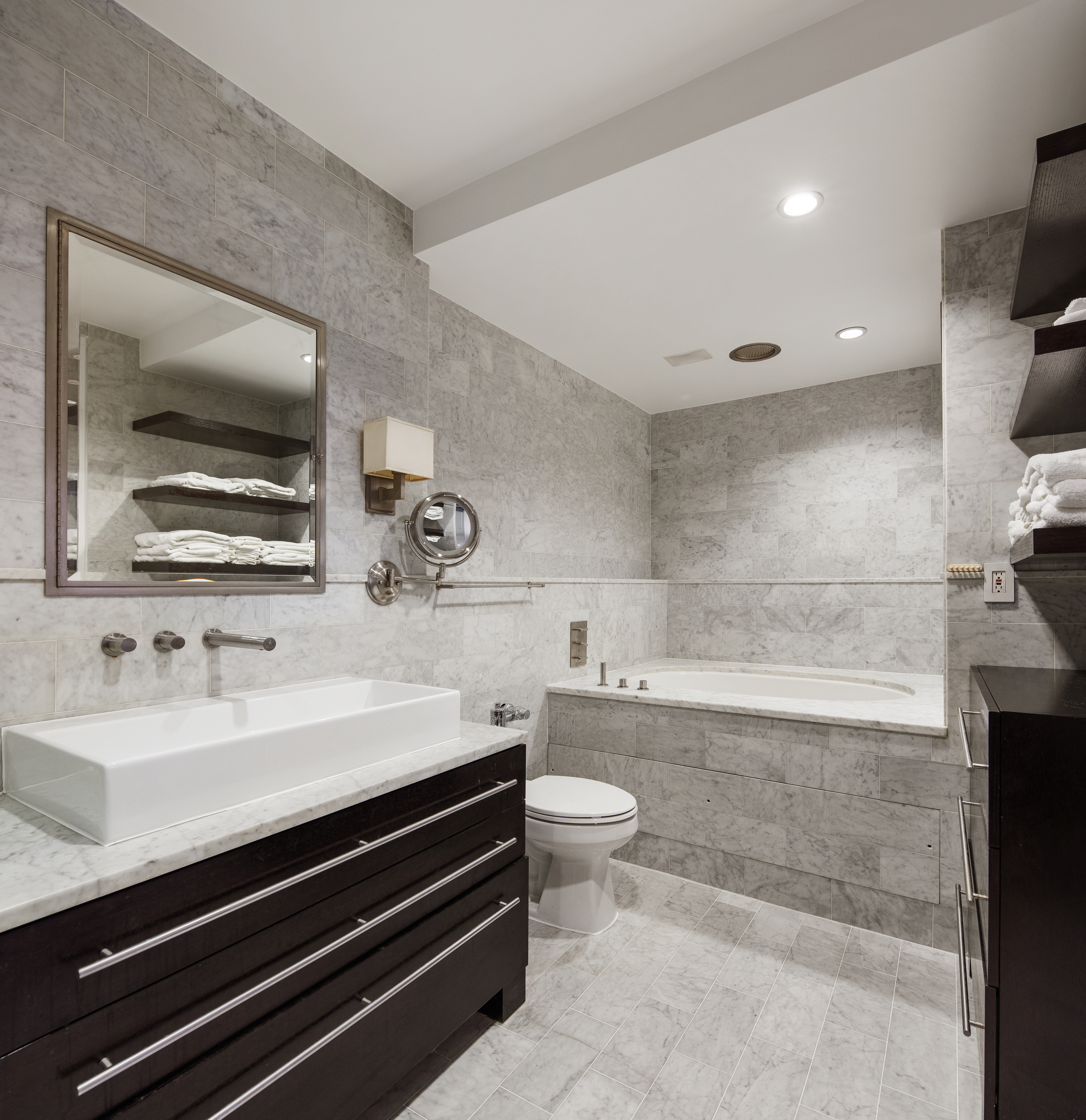 410 West 24th Street, Unit 4J Manhattan, NY 10011 - Photo 8 of 11 a bathroom with a sink a toilet and shower