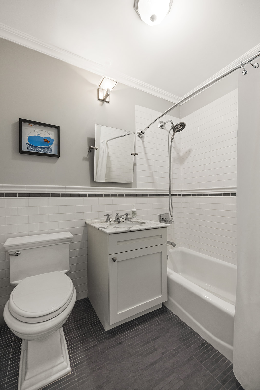 493 18th Street, Unit 2 Brooklyn, NY 11215 - Photo 9 of 13 a bathroom with a toilet and a bathtub