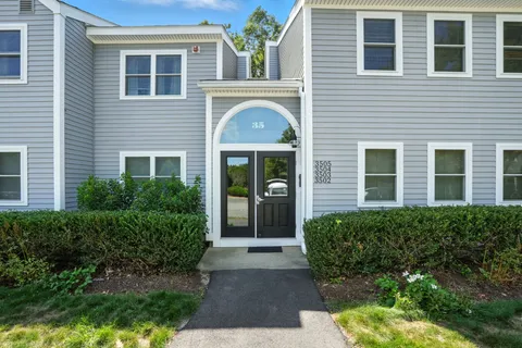 a front view of a house having yard