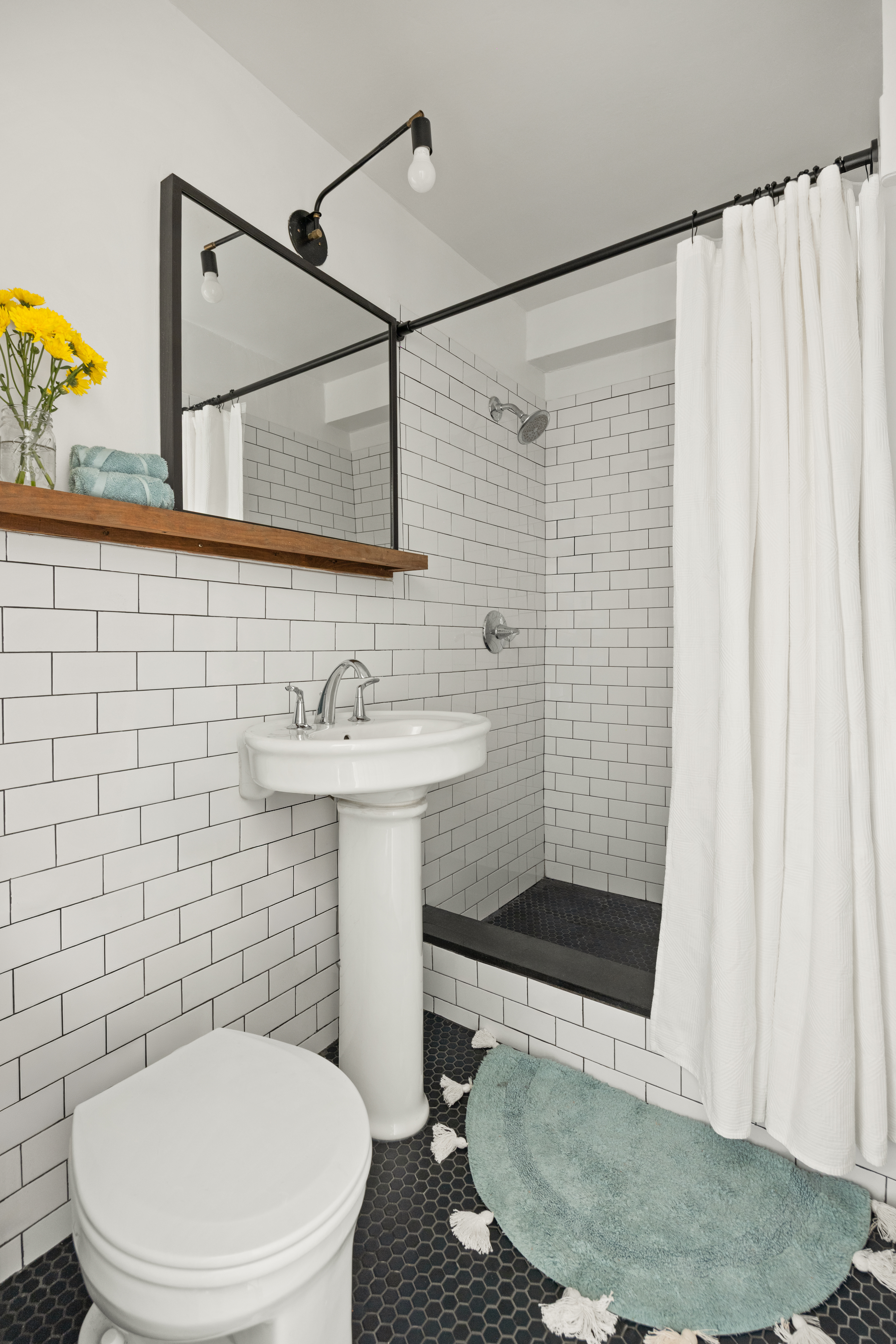 135 Ocean Parkway, Unit 1M Brooklyn, NY 11218 - Photo 8 of 11 a bathroom with a sink a toilet and shower
