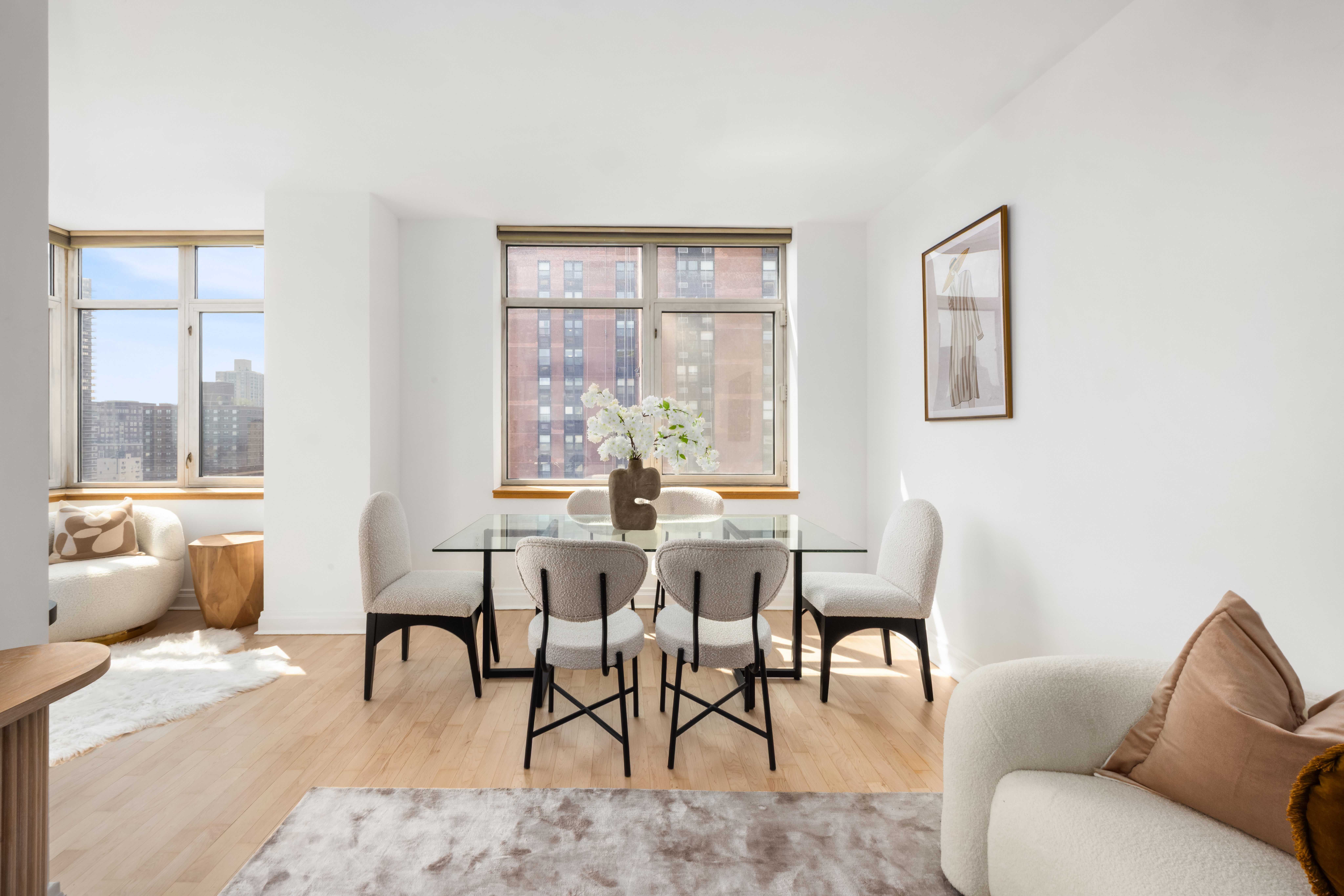 1760 2nd Avenue, Unit 30C Manhattan, NY 10128 - Photo 3 of 21 a living room with furniture and a large window