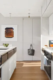 a kitchen with stainless steel appliances granite countertop a stove and a refrigerator