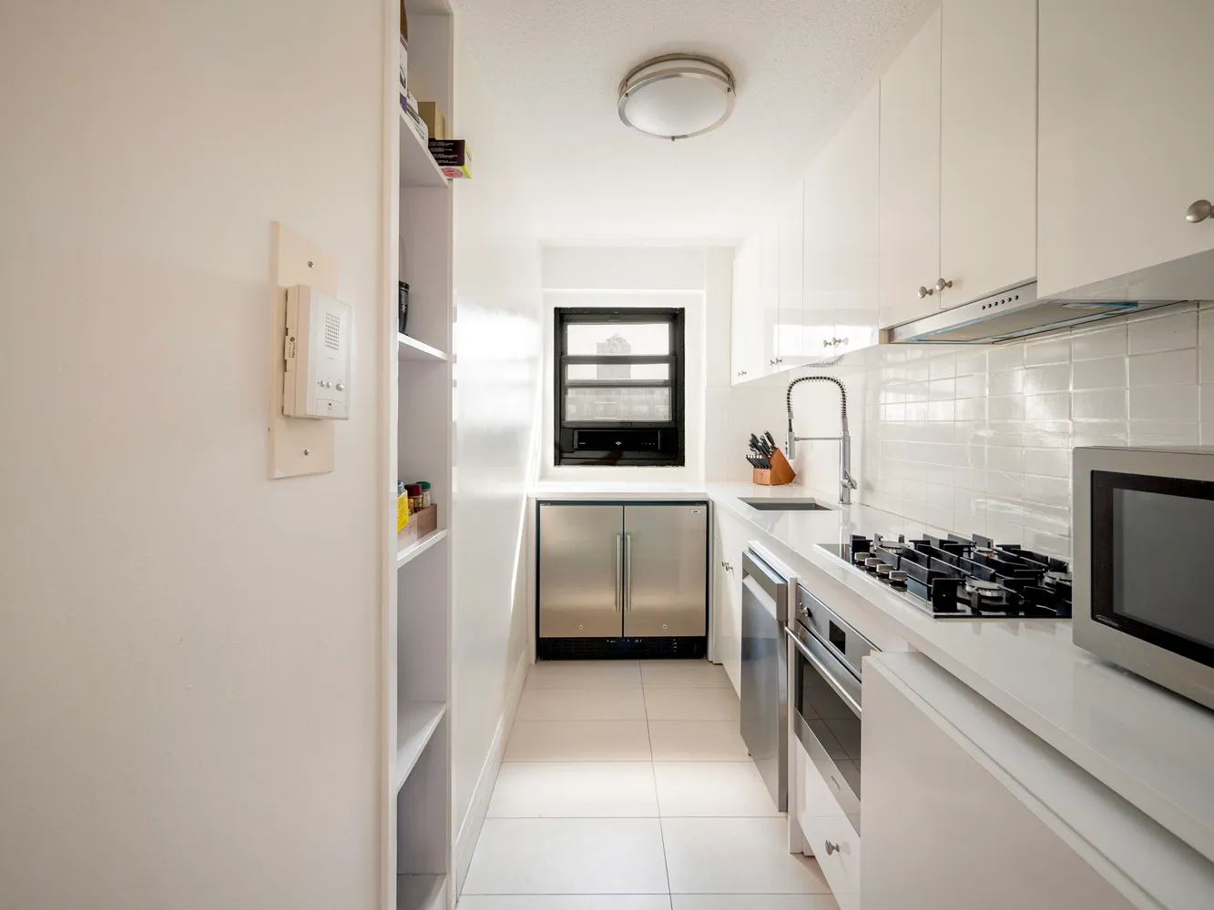 a kitchen with a stove and a refrigerator